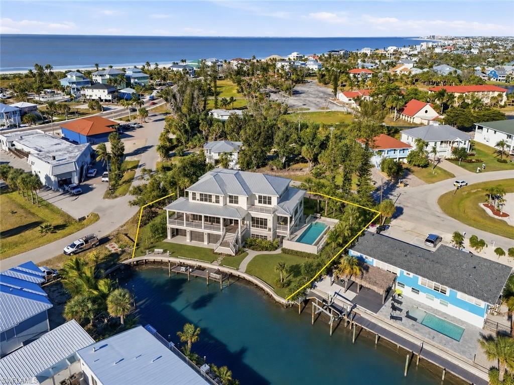 AI Rendering of custom single family waterfront home with slightly elevated pool
