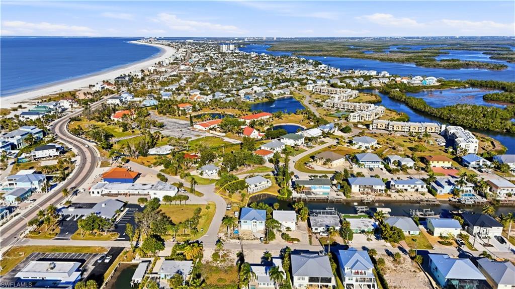 Aerial view of residential area with expansive coastline
