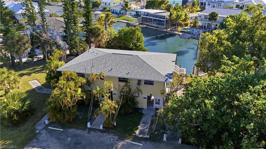 Aerial view of residential area with a nearby body of water - Virtually Edited Image