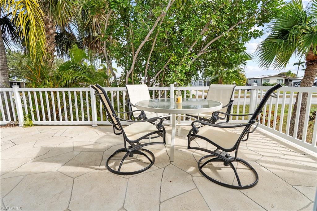 View of patio with outdoor dining area