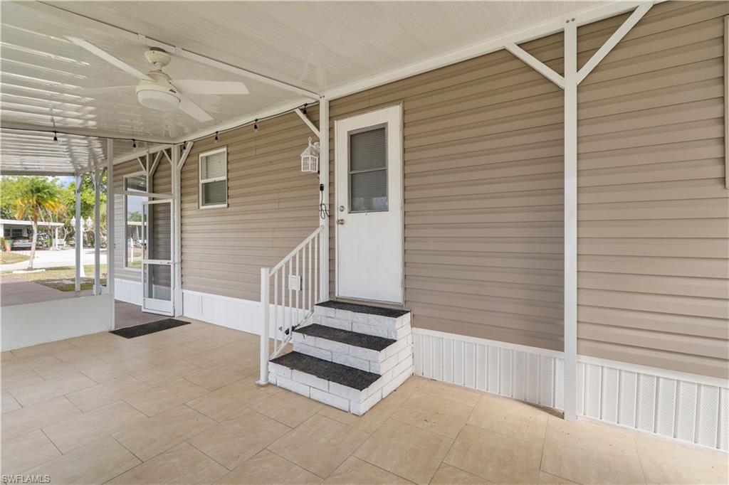 Entrance to property with a ceiling fan