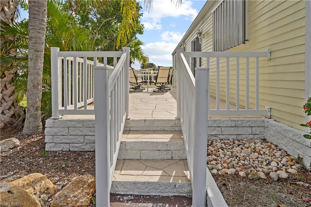 Wooden deck with outdoor dining area and a patio