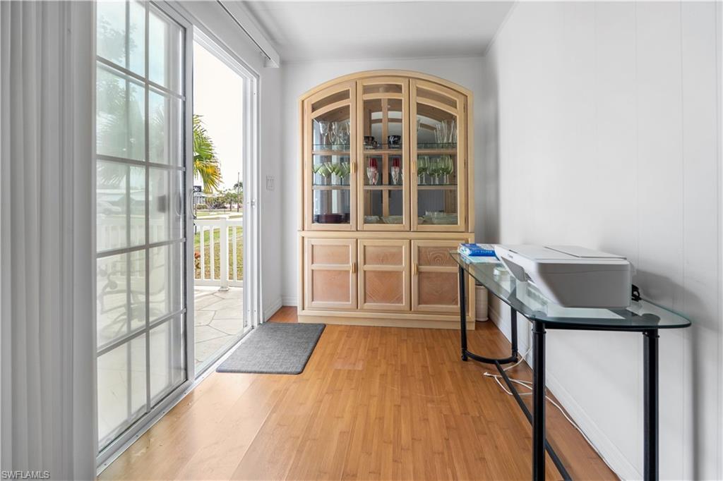 Doorway to outside with wood finished floors