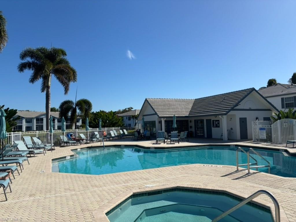 Community pool featuring a patio and a community hot tub