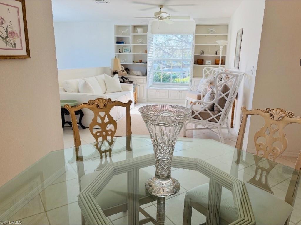 Dining area featuring built in features and ceiling fan