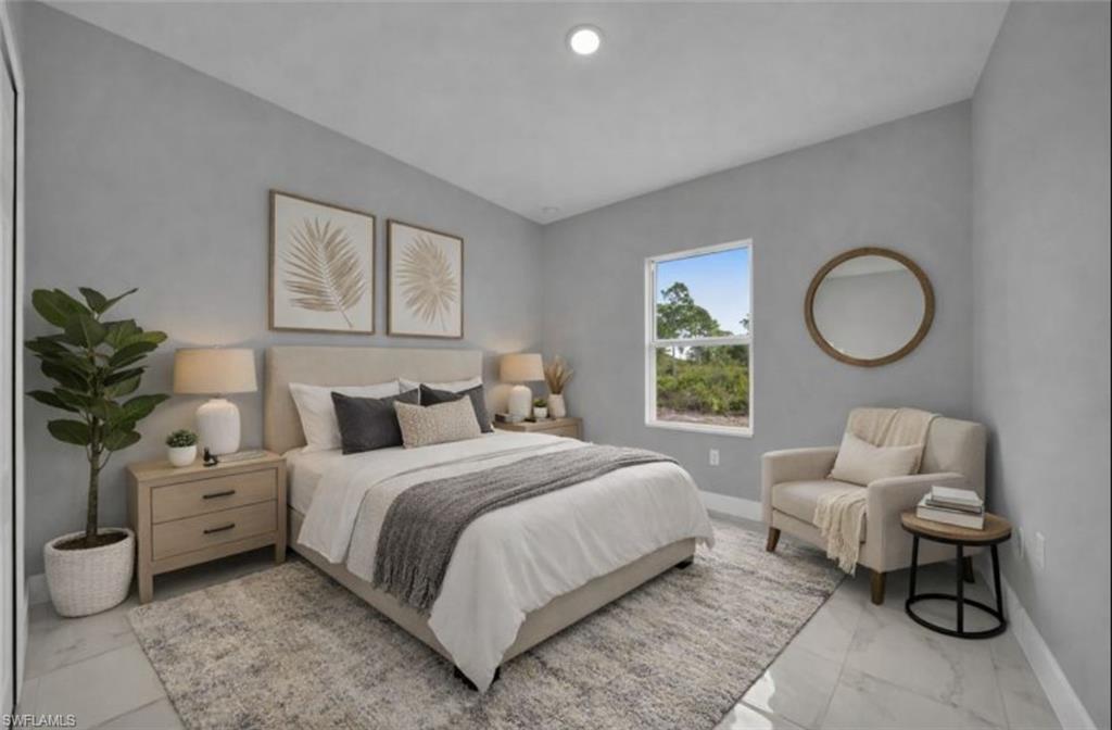 Bedroom with light marble finish floors