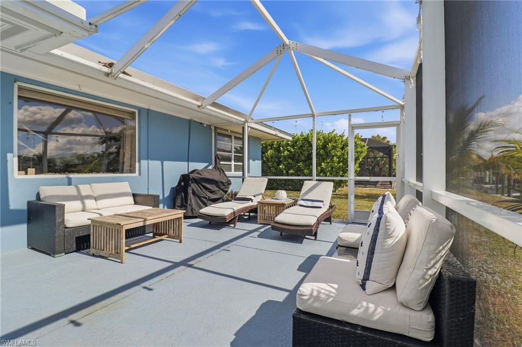 Sunroom featuring a patio area and outdoor lounge area