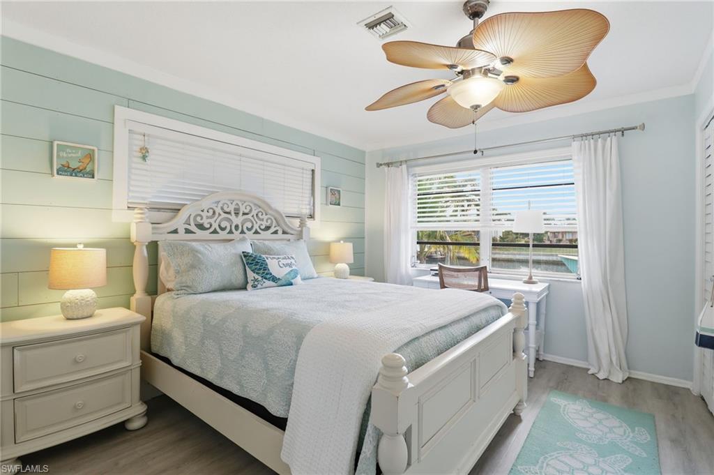 Bedroom featuring wood finished floors and ceiling fan