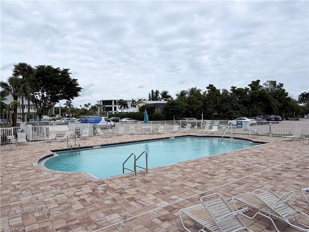 Community pool featuring a patio area