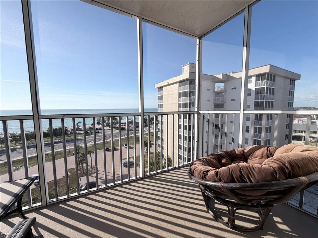 Balcony featuring a sunroom