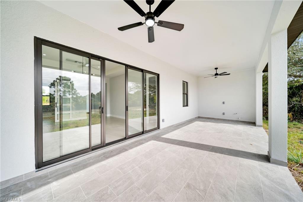 View of patio featuring a ceiling fan
