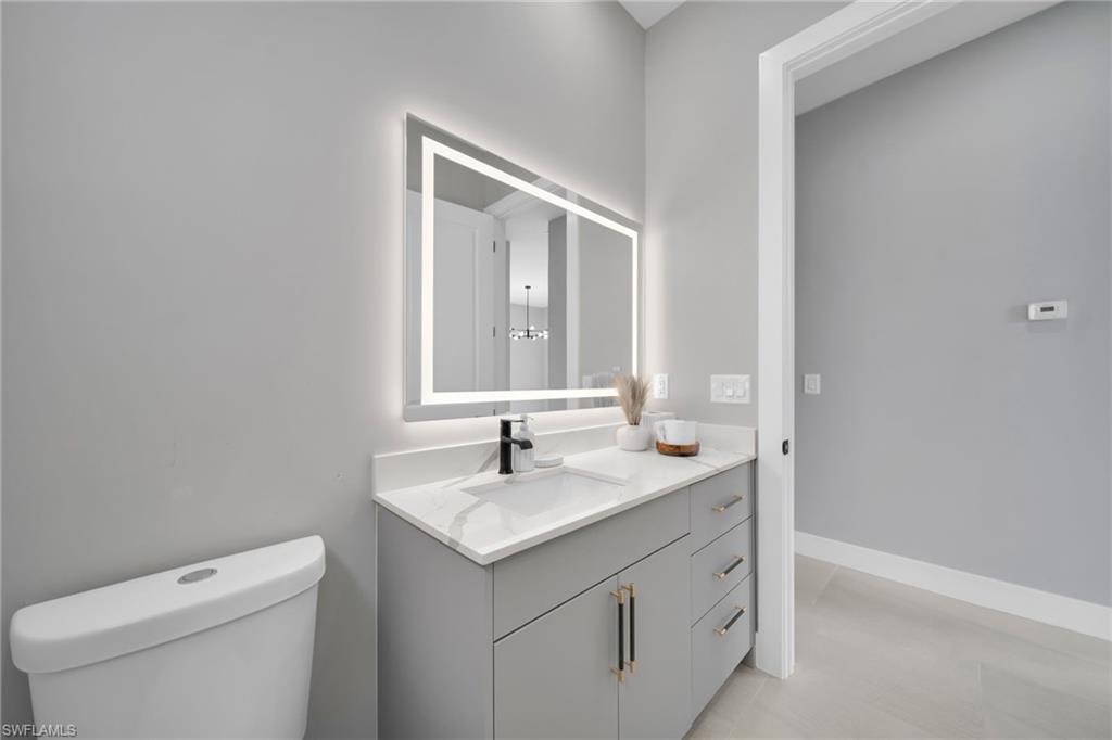 Bathroom with vanity and toilet
