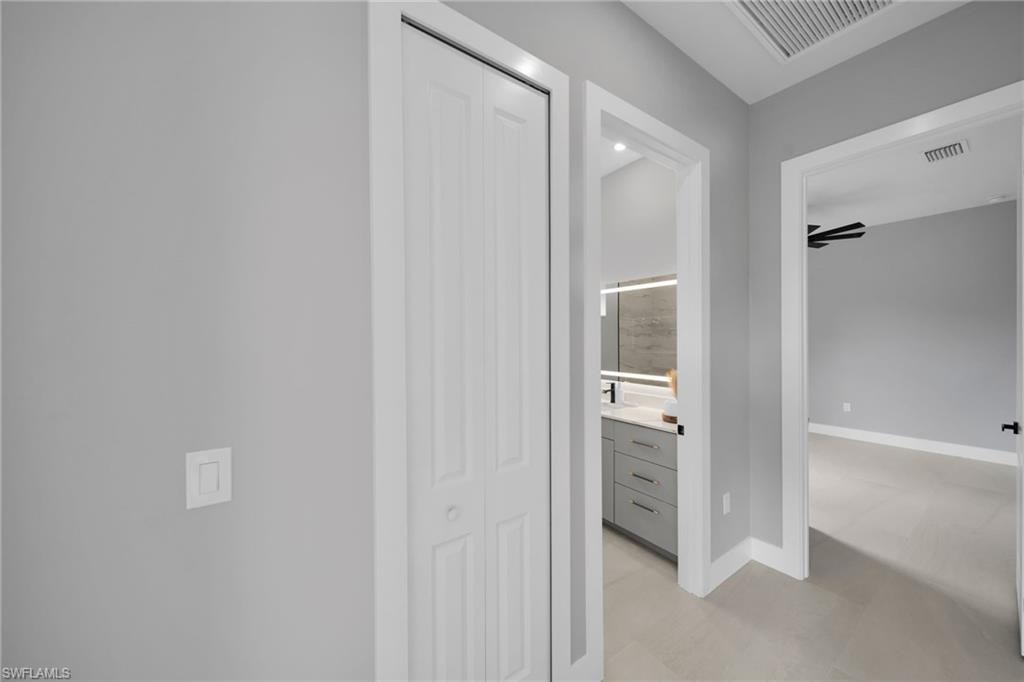 Hall featuring baseboards