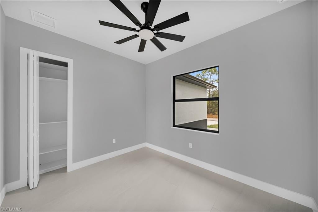 Unfurnished bedroom featuring a closet and a ceiling fan