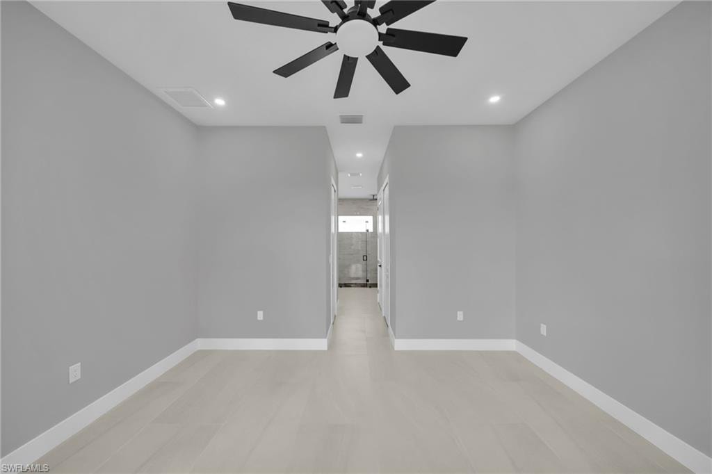 Unfurnished room with recessed lighting and ceiling fan