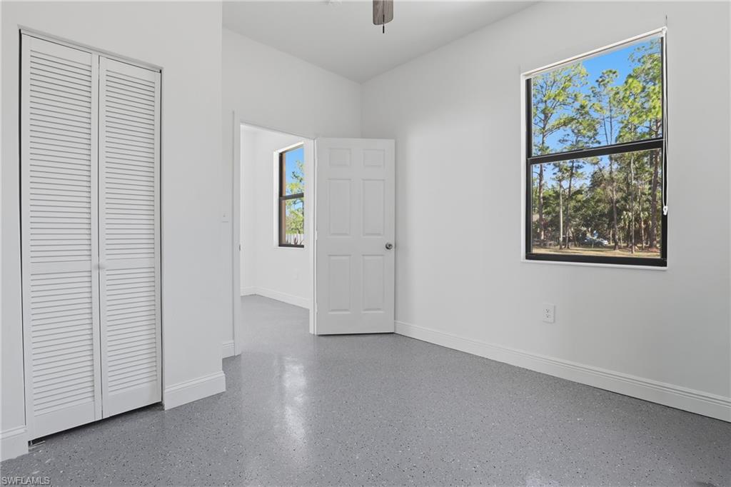Unfurnished bedroom with a closet and ceiling fan