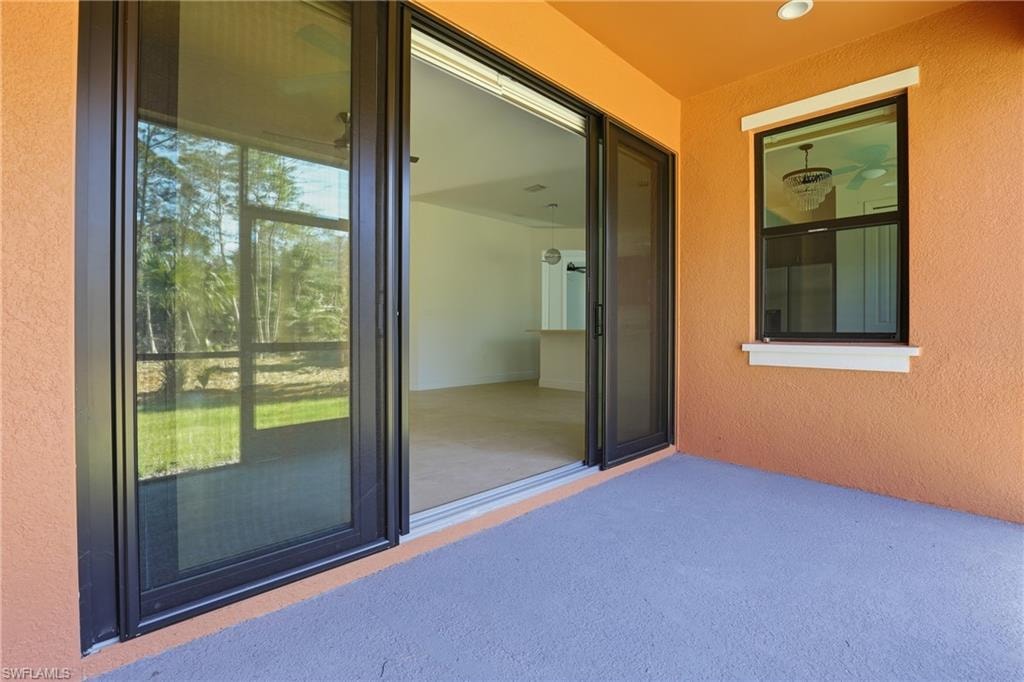 Entrance to property with a patio area
