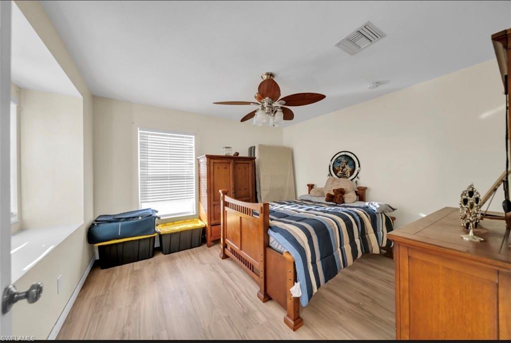 Bedroom featuring light wood-type flooring and a ceiling fan