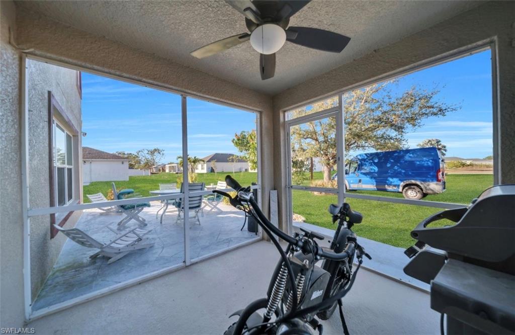 Sunroom with a textured ceiling