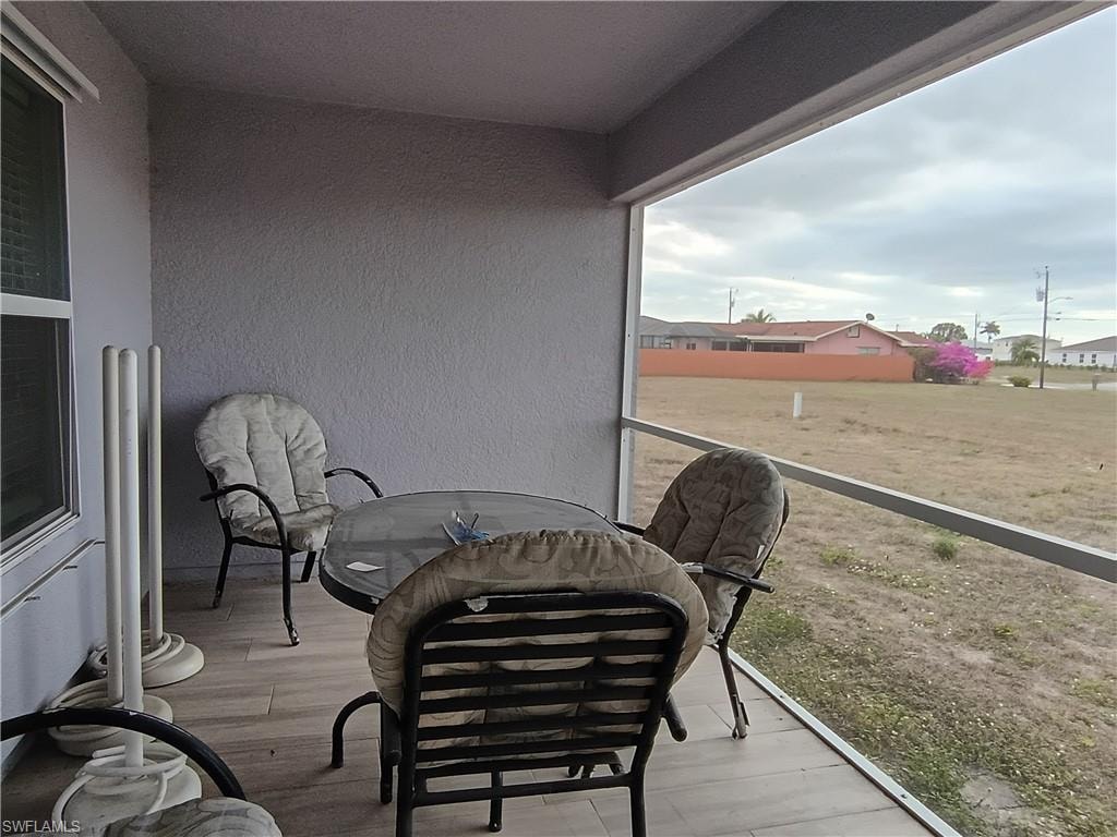 Balcony featuring a sunroom