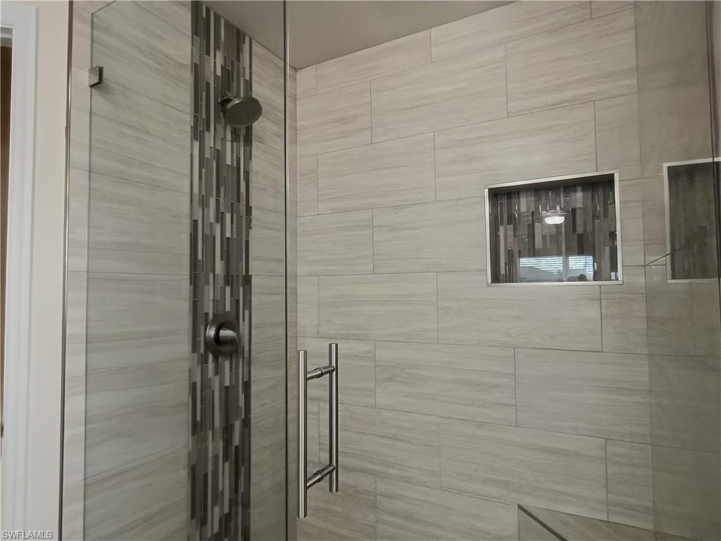 Bathroom featuring a shower stall