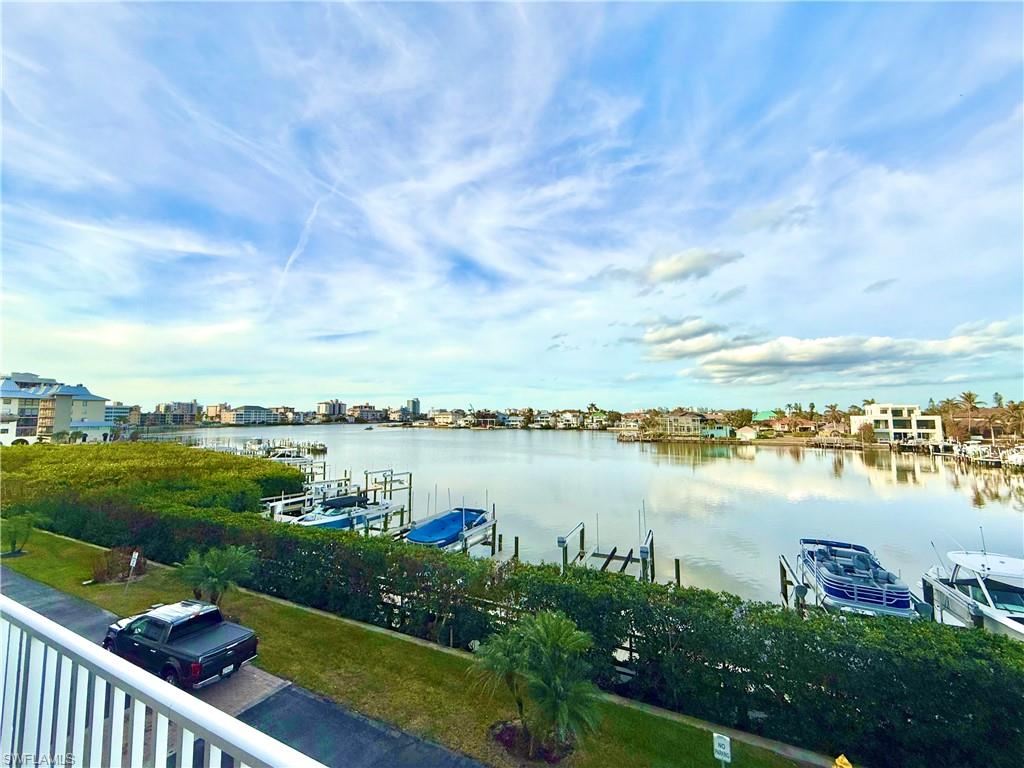 Water view with a dock and boat lift
