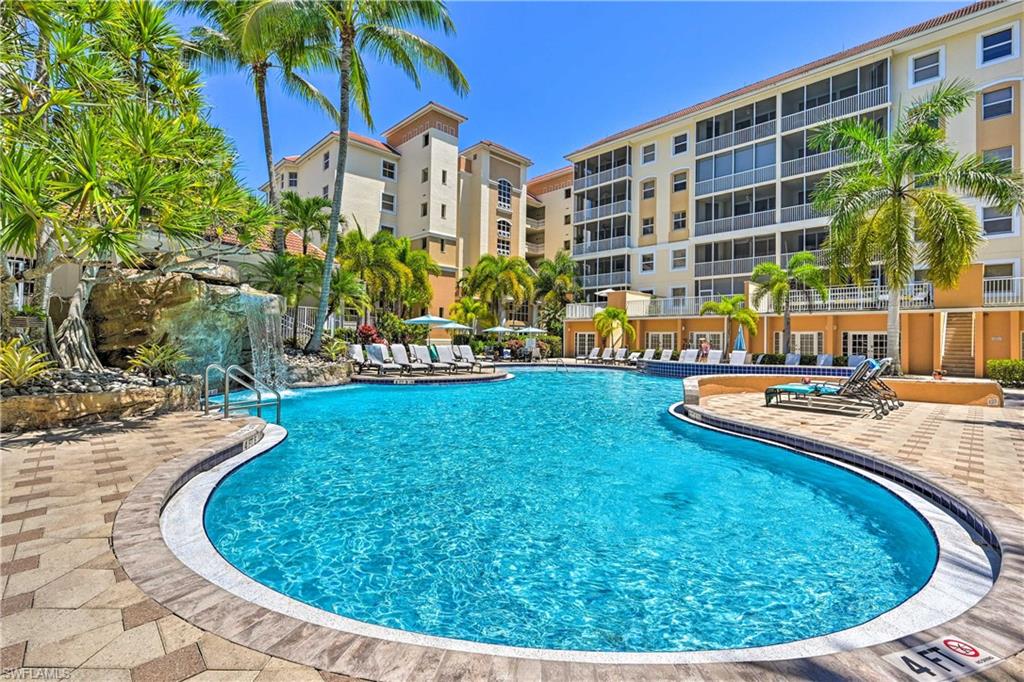 Community pool with a patio area