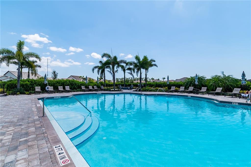 Community pool with a patio