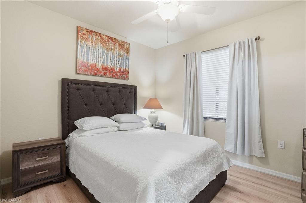 Bedroom featuring light wood-type flooring and a ceiling fan