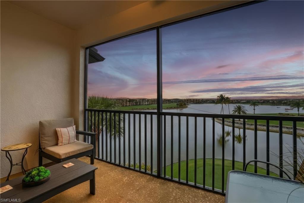 Sunroom / solarium with a water view