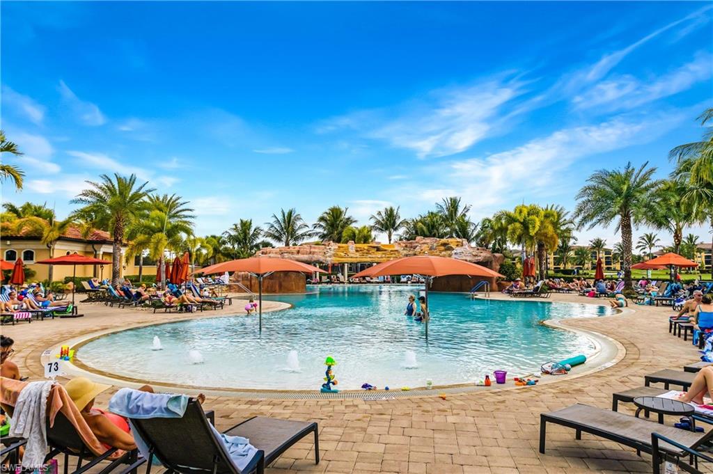 Community pool with a patio