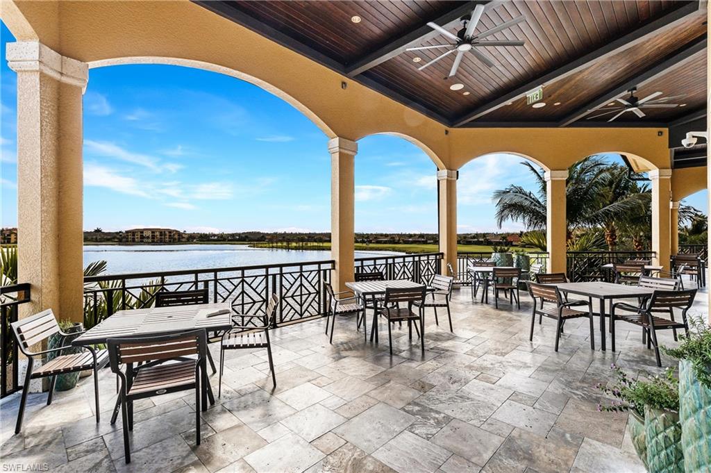 View of patio / terrace with outdoor dining space, a water view, and ceiling fan
