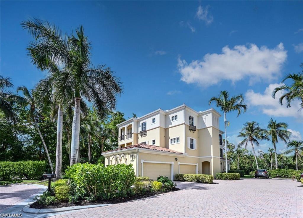 View of property exterior featuring driveway and stucco siding
