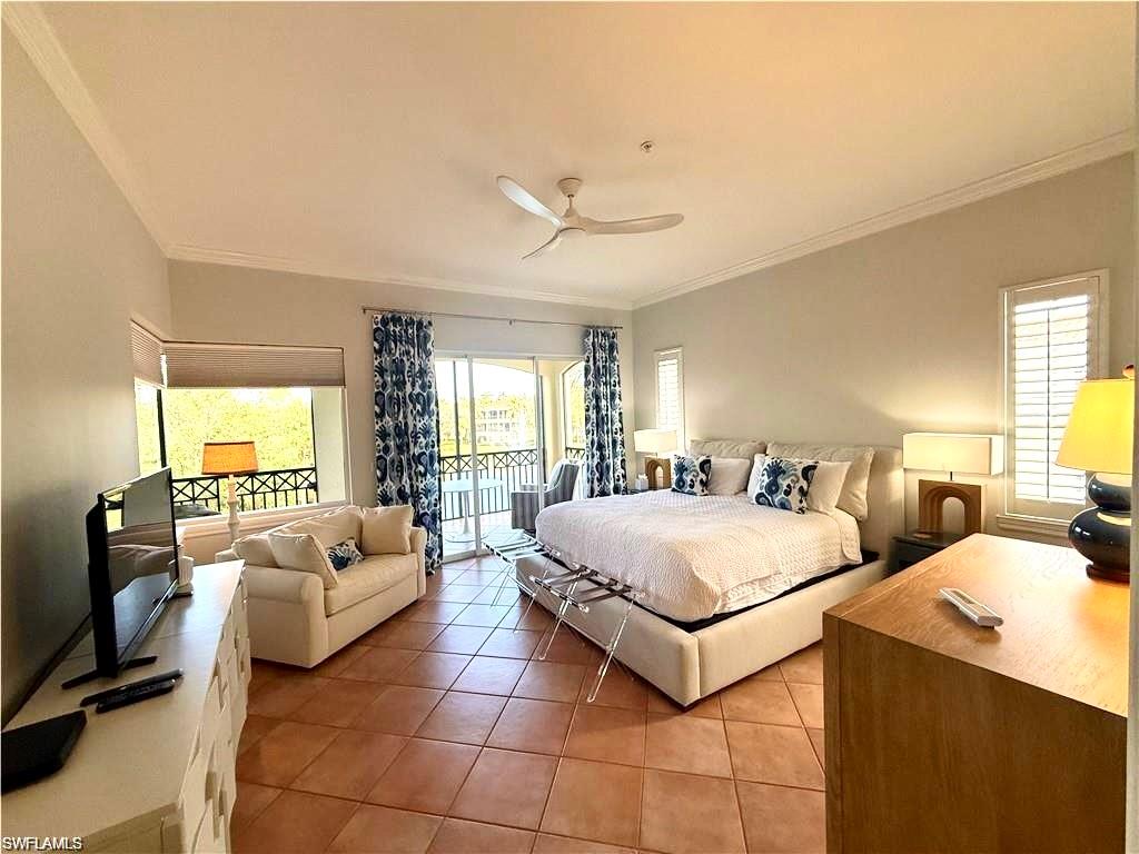 Bedroom with crown molding, access to exterior, light tile patterned flooring, and a ceiling fan