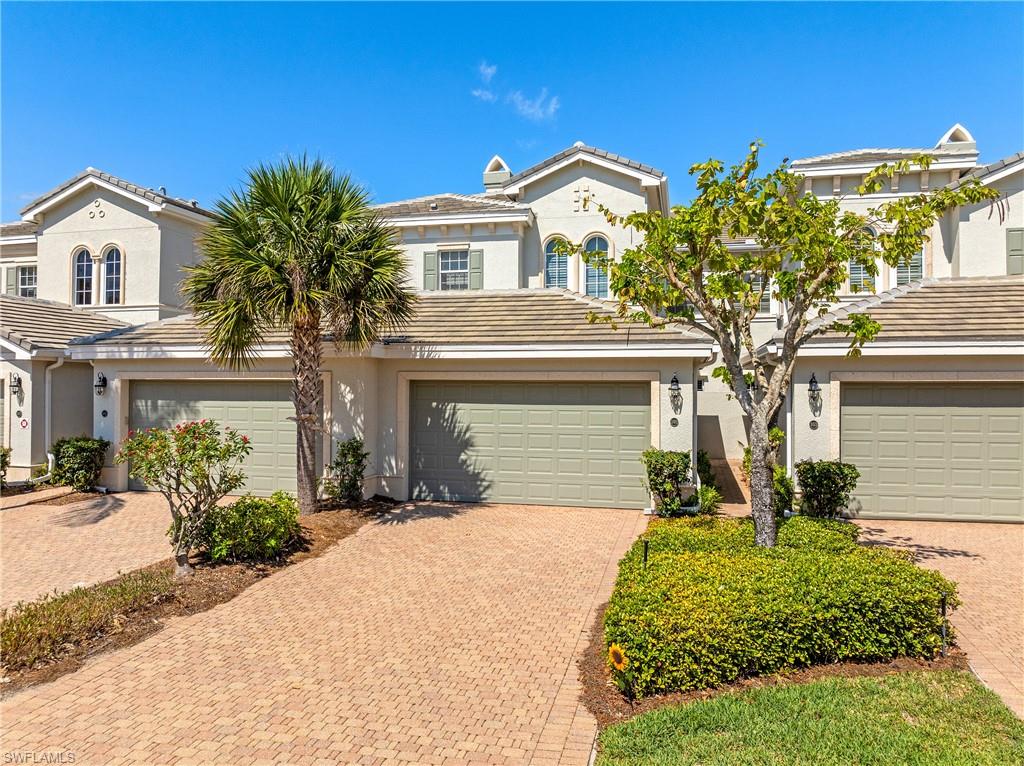 Mediterranean / spanish-style home with decorative driveway, stucco siding, a garage, and a tile roof