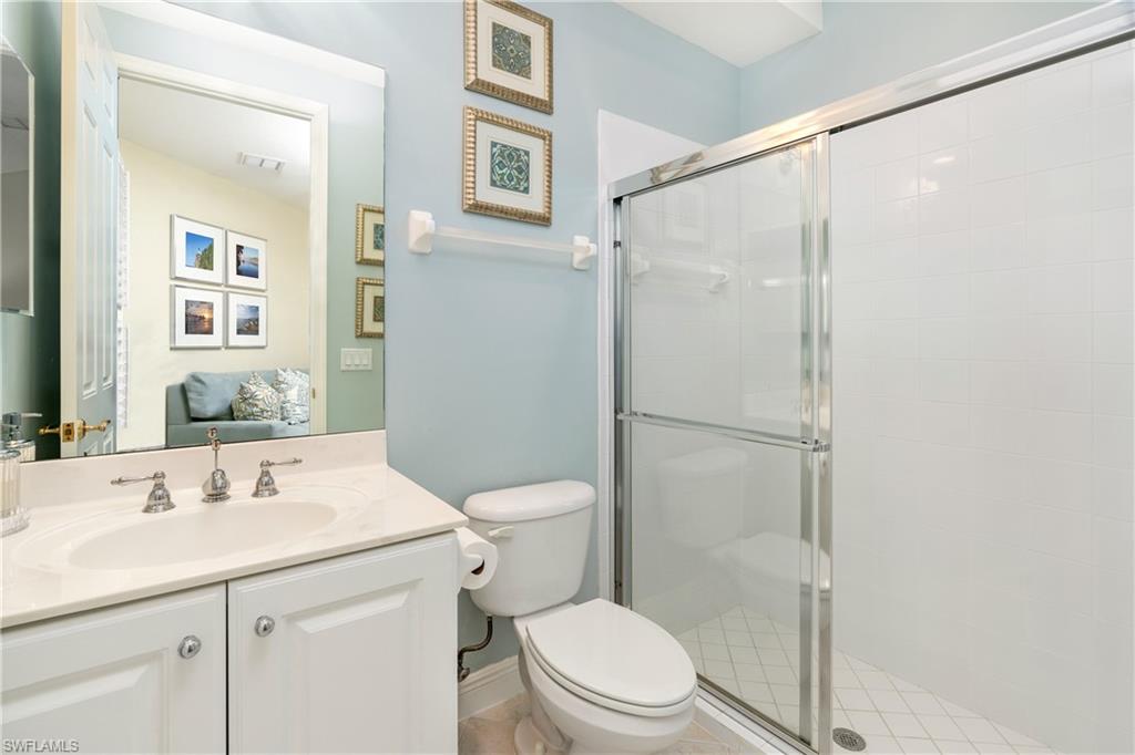 Bathroom with vanity and a shower stall
