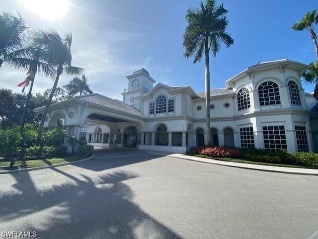View of building exterior featuring driveway