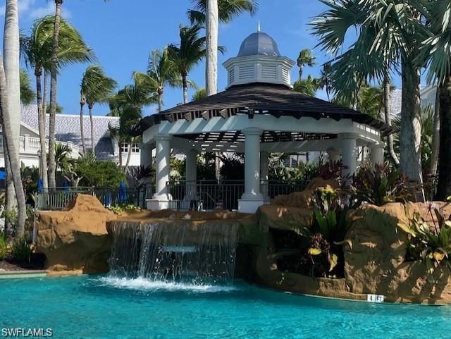 Swimming pool featuring a gazebo and a patio area