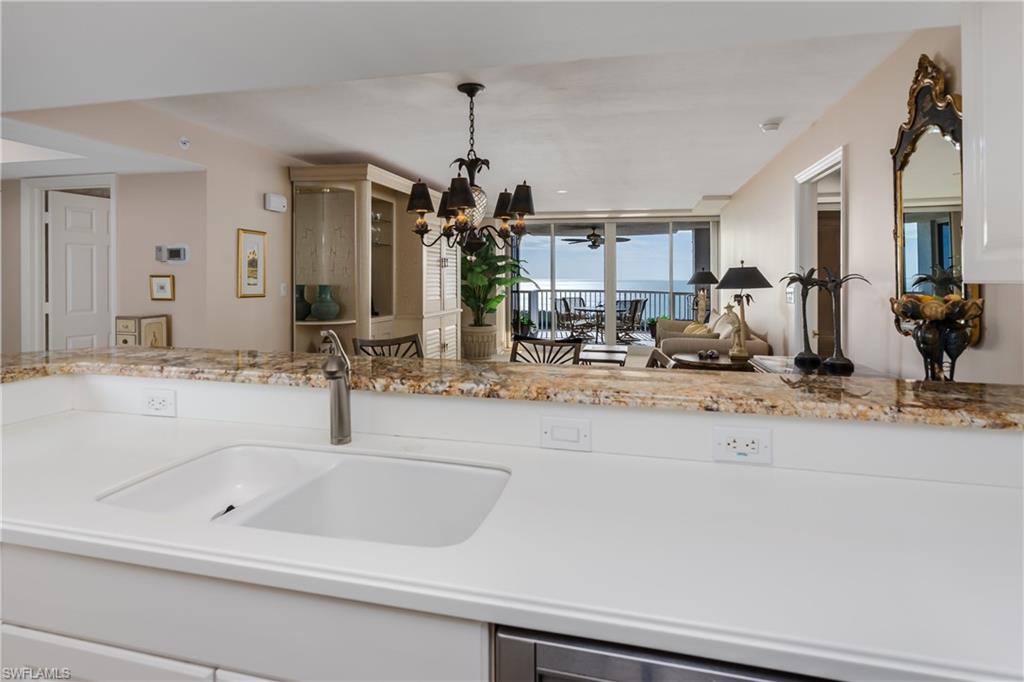 Your View from the Kitchen looking  towards the Great Room and beyond to the GULF!!
