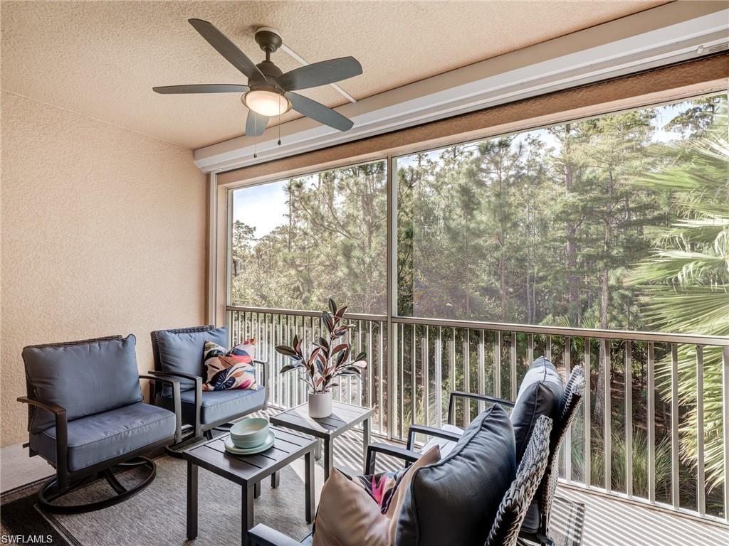 Sunroom featuring ceiling fan