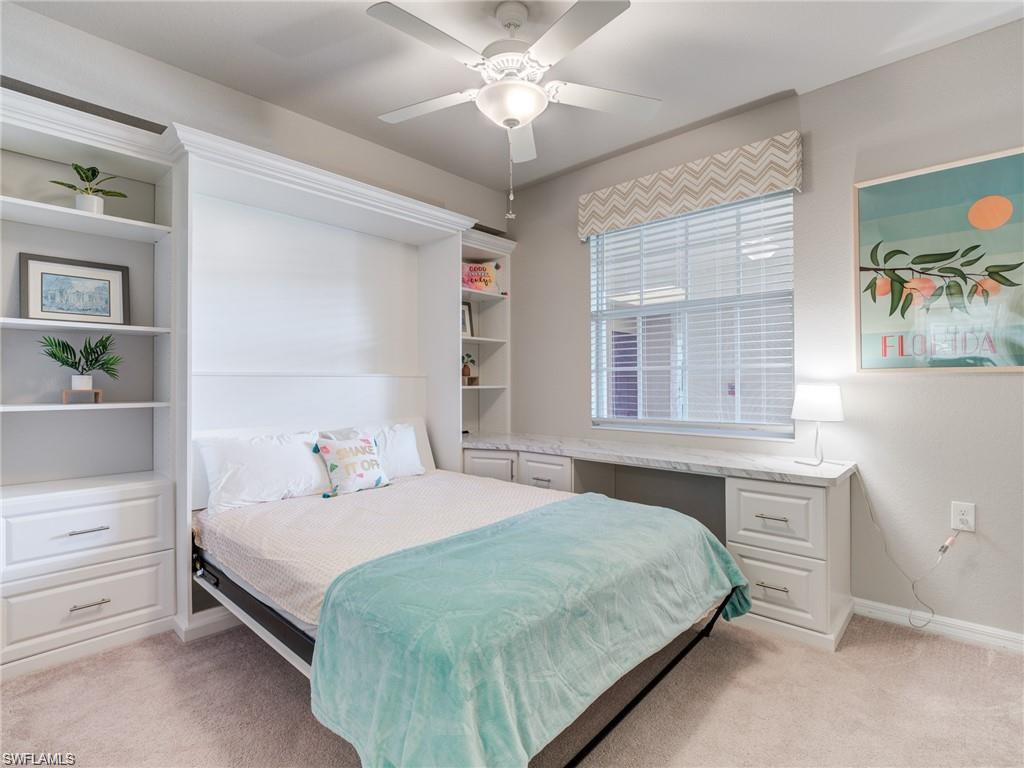 Bedroom featuring ceiling fan and light colored carpet