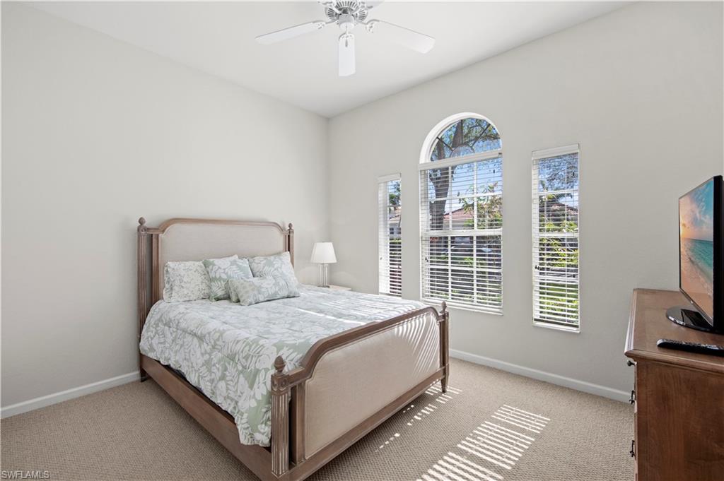 Bedroom featuring a ceiling fan and carpet flooring