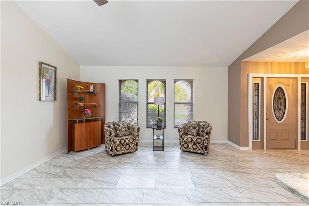 Living area featuring light marble finish flooring