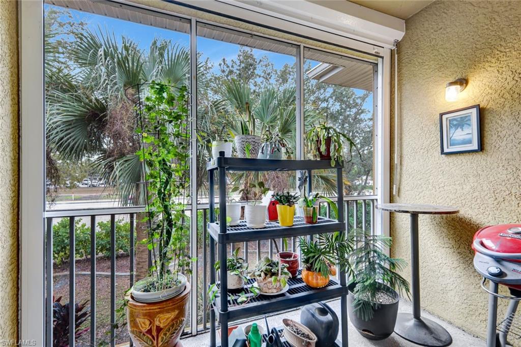Balcony with a sunroom and area for grilling