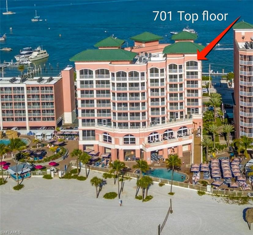 View of apartment building / complex with a water view