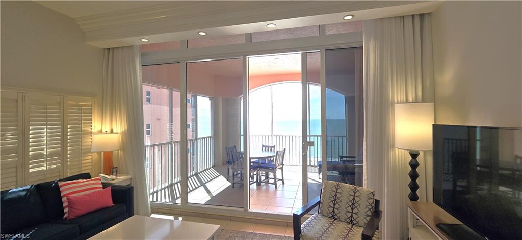 Tiled living room featuring recessed lighting