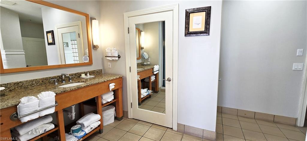Bathroom with vanity and light floors