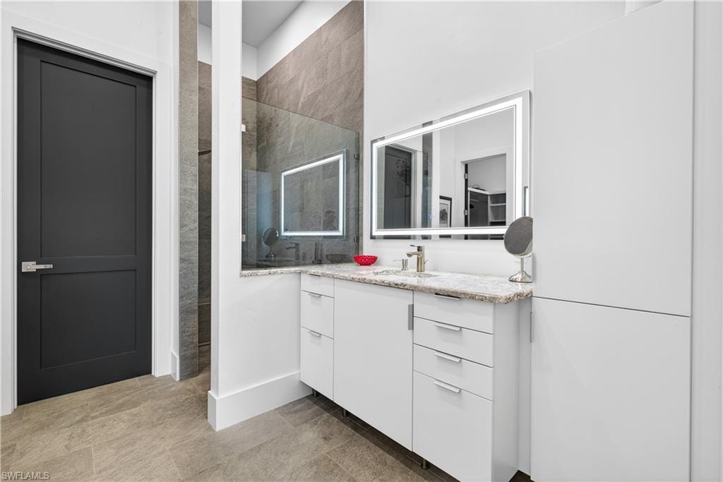Bathroom with walk in shower and vanity