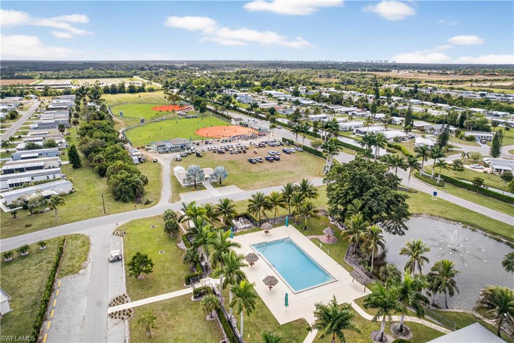 Aerial view of property and surrounding area with a pool area
