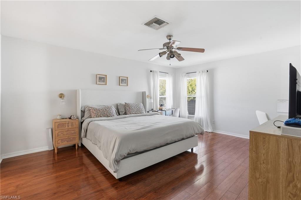 Bedroom with wood-type flooring and a ceiling fan